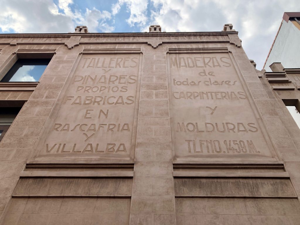 Engraved text on the facade of a building in Madrid.