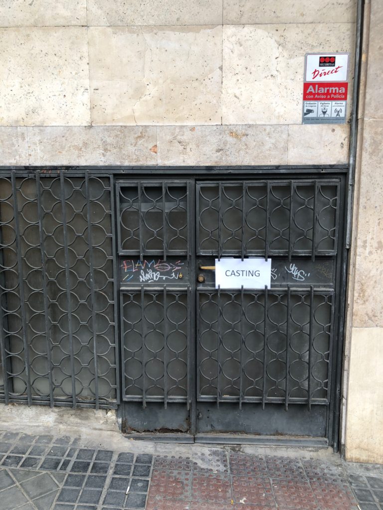 A sign marked "casting" on a small iron door.