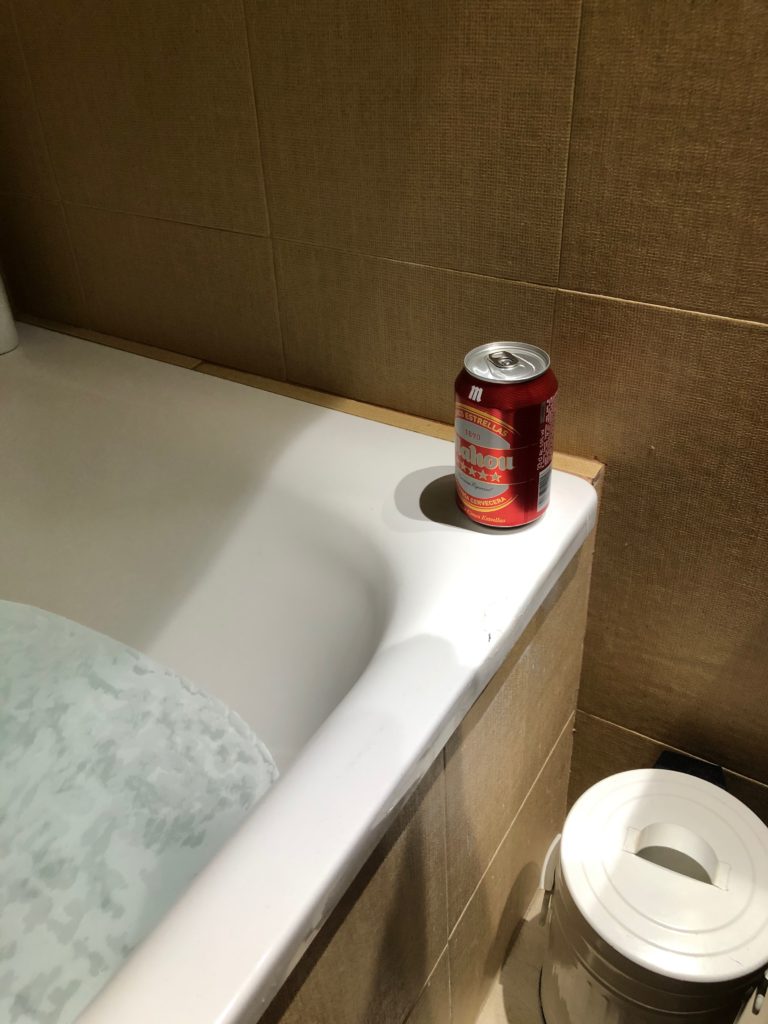 A bath with a beer.