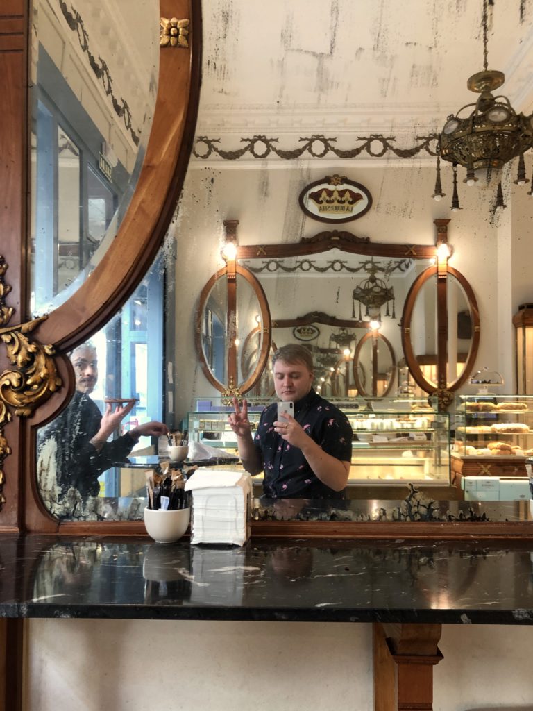A selfie in the old mirrors of La Duquesita, a bakery in Madrid.