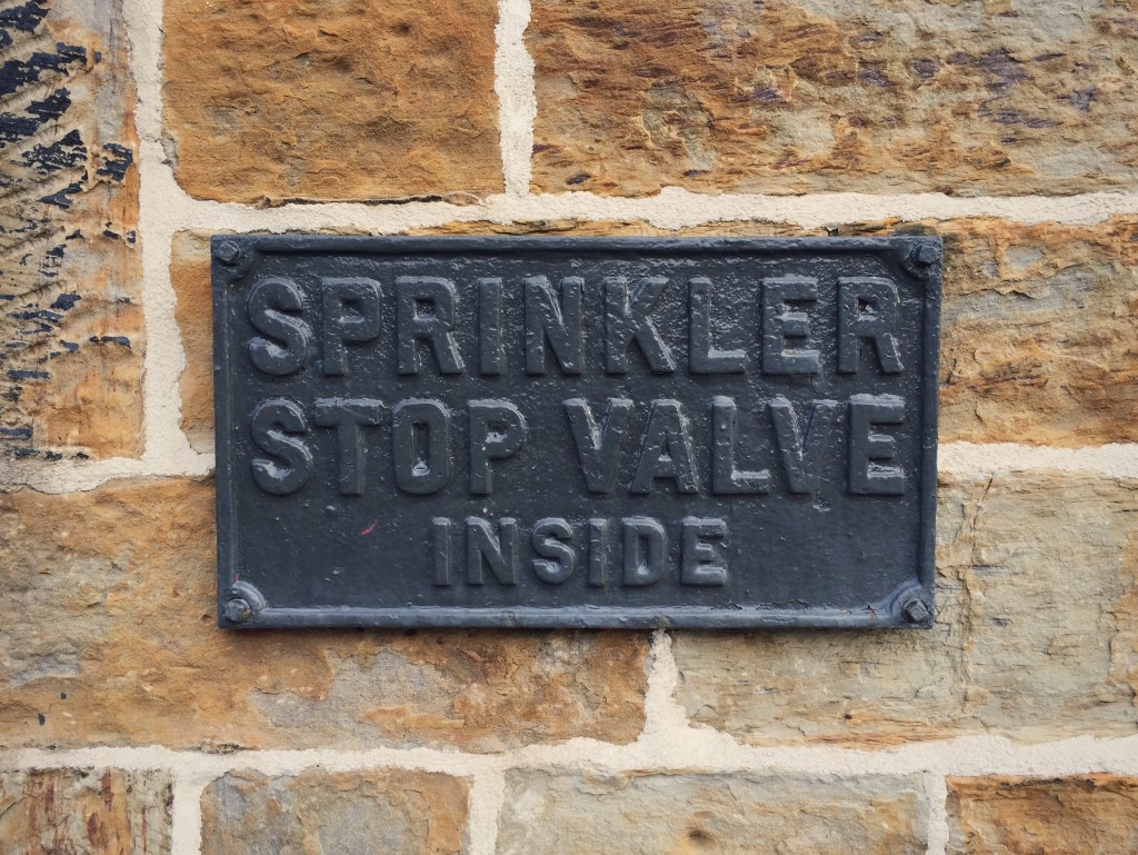 An old plaque in some irregular typE