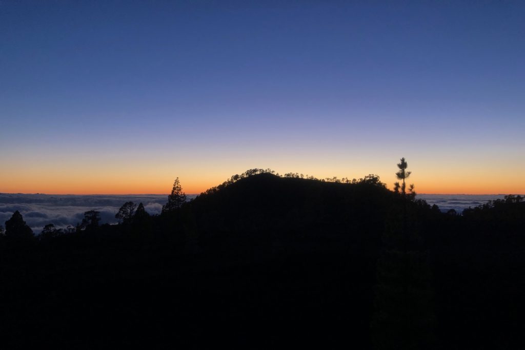 A sunset over the layer of clouds, taken from the side of the Teide volcano in Tenerife.