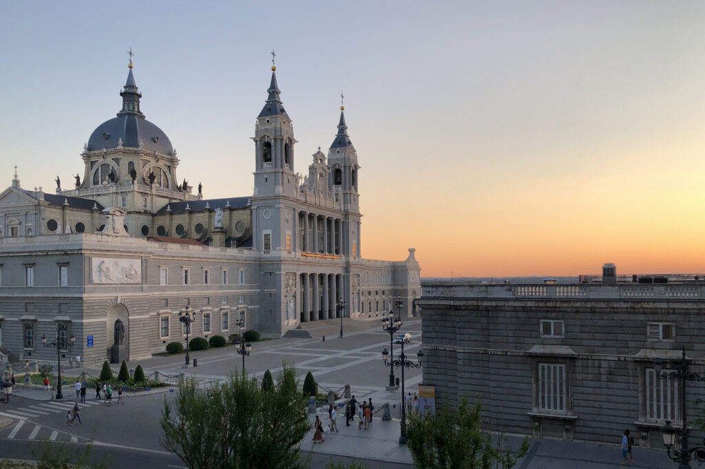Madrid's cathedral is seen in the evening light of the sunset.