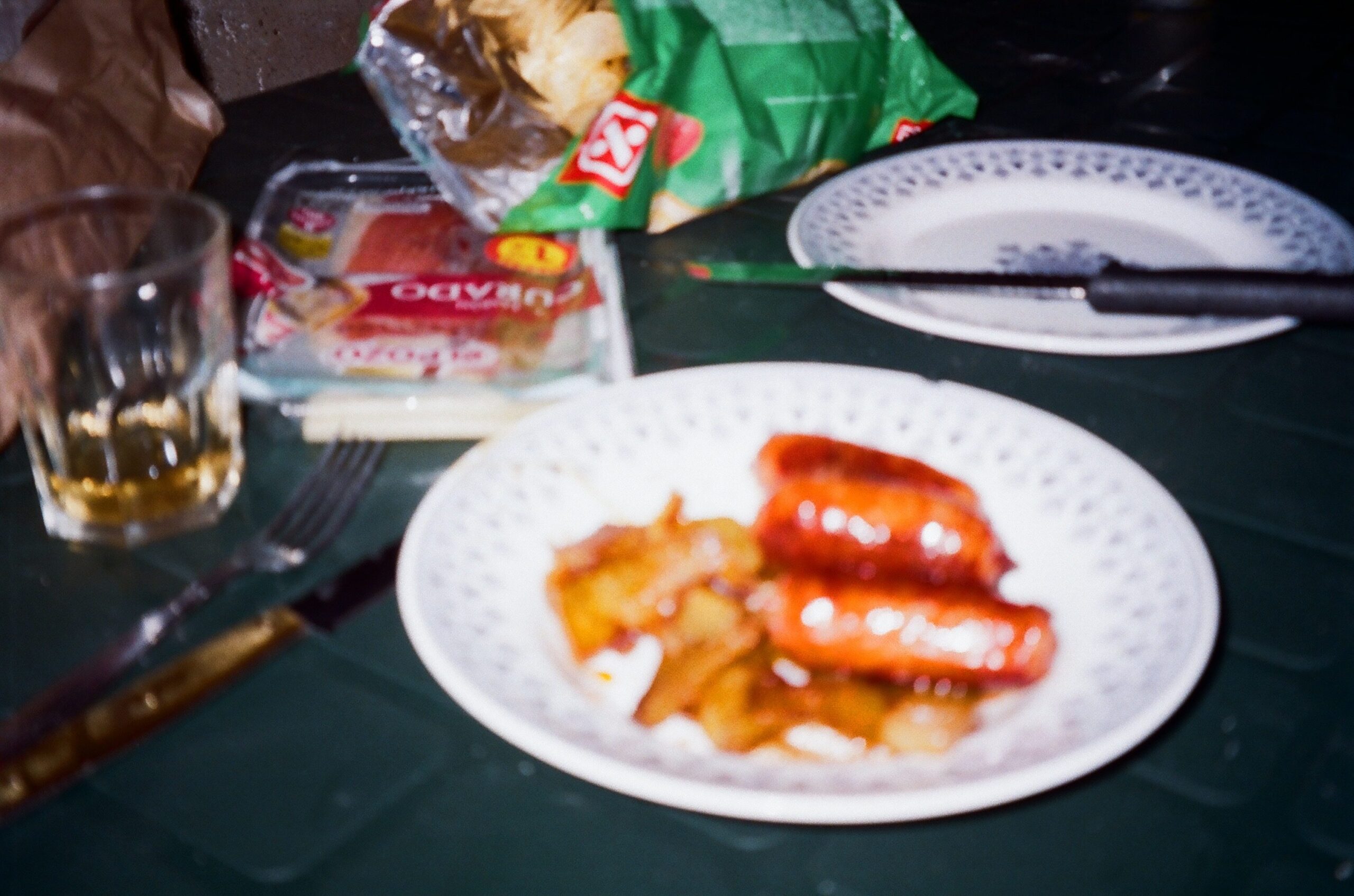 Chorizo and fried potatoes on a plate.
